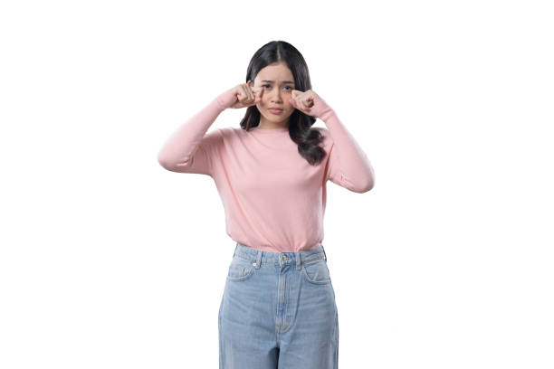 istock Indonesian Woman on white Background looking sad and crying 1411761677