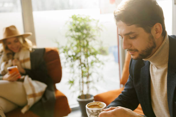 istock Business people enjoying coffee break in pet friendly cafe 1411761701
