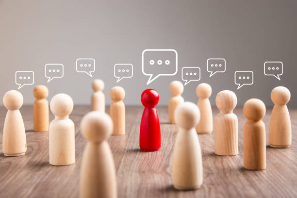 istock Wooden figurine with speech bubble. Mingle, discussion, chatting concept 1411762897