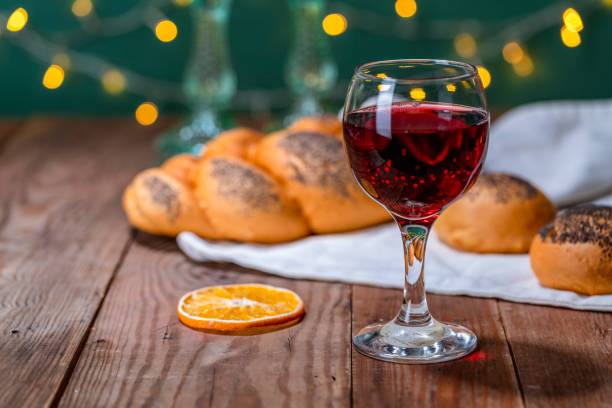 Shabbat Shalom. Challah bread, shabbat wine and candles on the festive background stock photo
