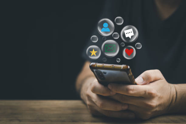 istock Social media technology concept, man hand using smartphone Login to the online network Use social media to do business and marketing payment from home through the Internet. 1411766895