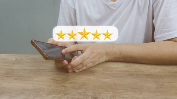 istock Customer service and Satisfaction concept Men's hands doing online assessments in the satisfaction rating the popular service company allows customers in order to improve and develop the organization 1411776231