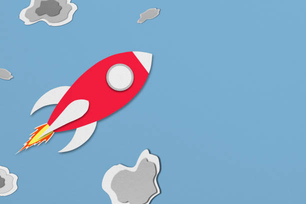 istock red paper spaceship flying in space with meteors 1411777227