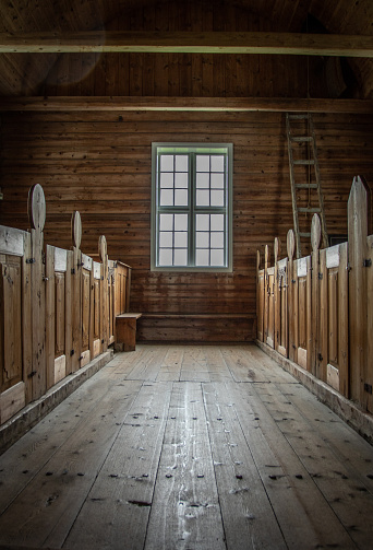 A church window with pews either side Stavanger Norway