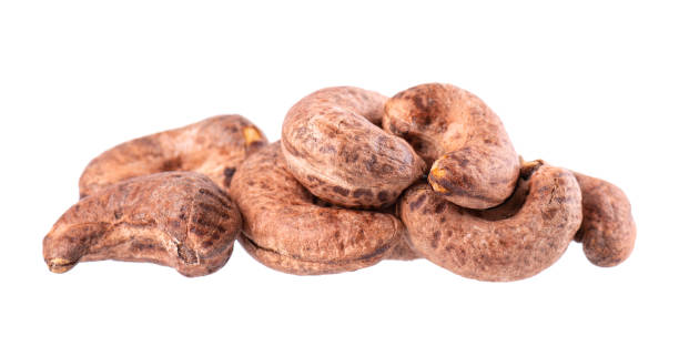 istock Cashew nuts in shell isolated on white background. Roasted and salted cashew nuts. Clipping path. 1411784774