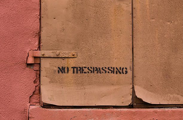 No trespassing on closed shutter stock photo