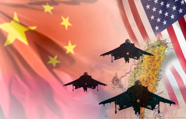 China and taiwan tensions and war concept. Fighter aircraft silhouettes over a blurred map of taiwan with Chinese and USA flags on the background. Suitable for tensions between mainland China and Taiwan and Taiwan invasion