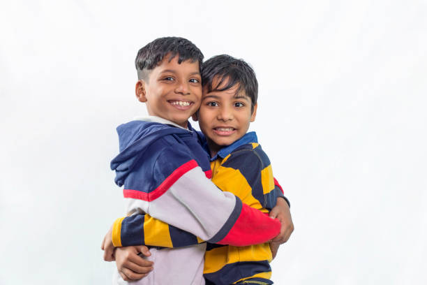 istock portrait of two kid boys hugging each other 1411791286