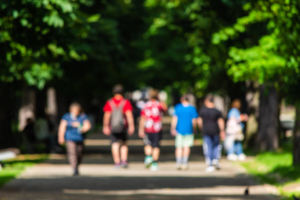 istock Unrecognizable kids walking in park 1411792408