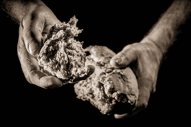 istock Helping hand with piece of bread 141179255