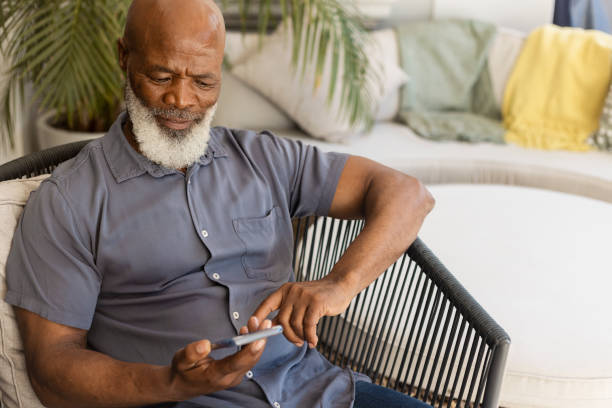 istock Senior man looking on surprised on his phone 1411793523