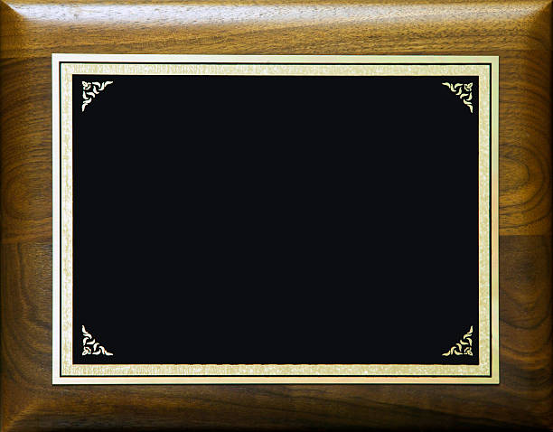 istock Black, blank plaque on wood background 141179718
