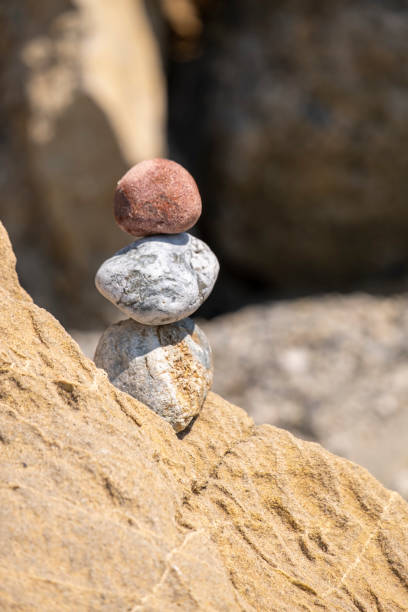 istock Balanced Pebbles Pyramid on the Beach. Zen stones 1411798192