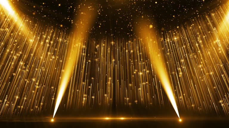 Golden particle light and light illuminate the background of the award stage