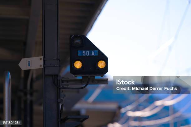 Closeup Of Railway Signal At Railway Station Airolo Canton Ticino With Railway Tracks And Platform On A Sunny Summer Day Stock Photo - Download Image Now