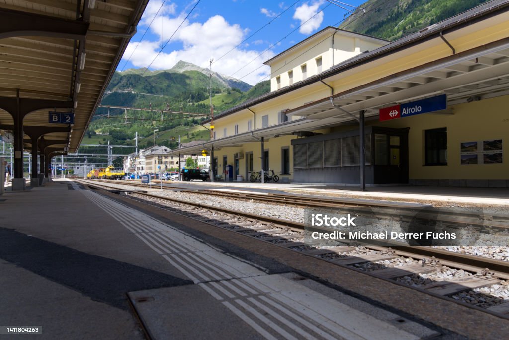 Railway station Airolo, Canton Ticino, with railway tracks and platform on a sunny summer day. Photo taken June 25th, 2022, Airolo, Switzerland. Airolo Stock Photo