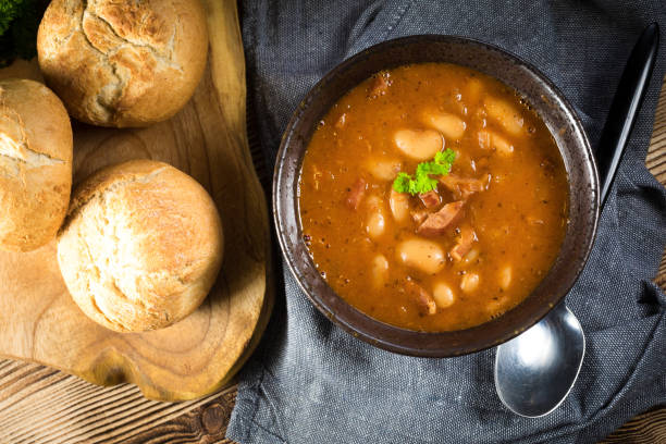 istock Beans with tomato sauce, bacon and sausage. 1411804779