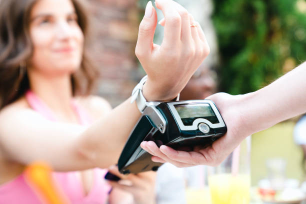 paying contactless with smartwatch stock photo