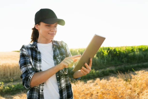 istock Woman farmer with a digital tablet 1411806919