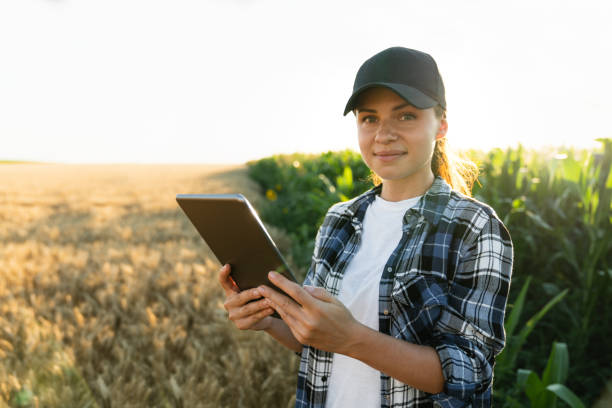 Woman farmer with a digital tablet stock photo