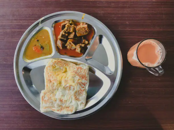 Photo of Roti Prata or Roti Canai with Teh tarik. Very famous food and drink in Malaysia