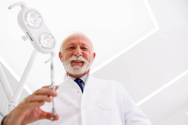 istock Dentist applying local anesthetic to patient 1411807034