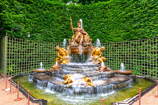 Paris, France - May 2019: Fountain of Triumphant France (Le Bosquet de l'Arc de Triomphe) in Versailles gardens