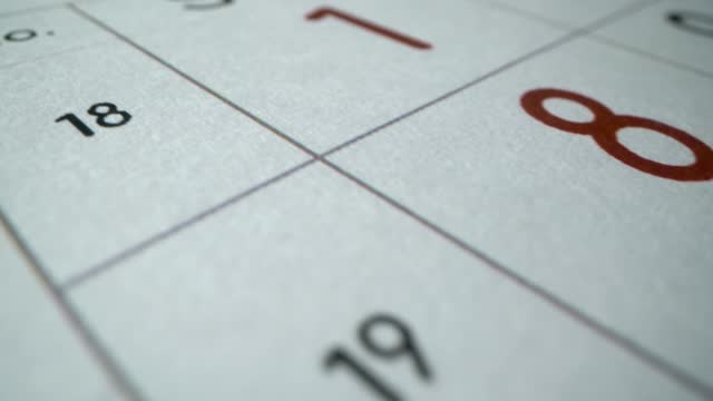 Calendar. Macro shot. many business days and weekend. Holidays. Low angle closeup shot. 2022