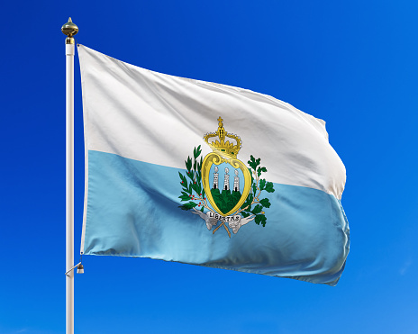 Flag of San Marino on the blue sky. Isolated with clipping path. 3D illustration.