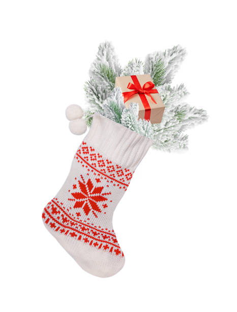 istock Christmas stocking white with fir branches, a gift on a white background 1411809666