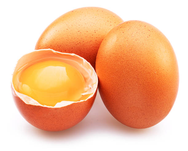 istock Brown chicken eggs and egg yolk isolated on white background. 1411811153