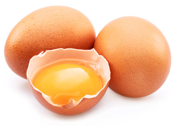 istock Brown chicken eggs and egg yolk isolated on white background. 1411811161