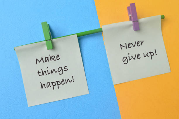 istock Paper notes with phrase MAKE THINGS HAPPEN! and NEVER GIVE UP! 1411812951