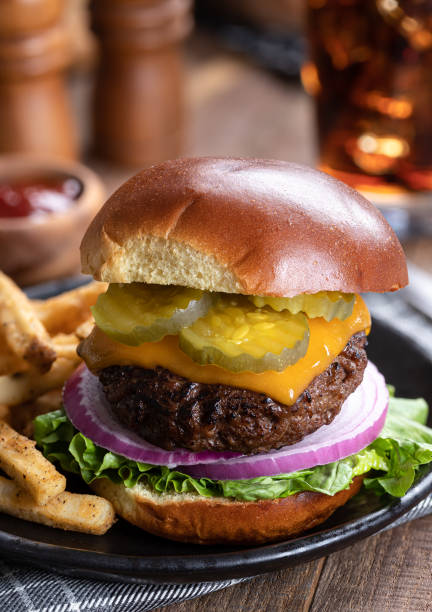 istock Cheeseburger with pickles, onions and lettuce 1411813043