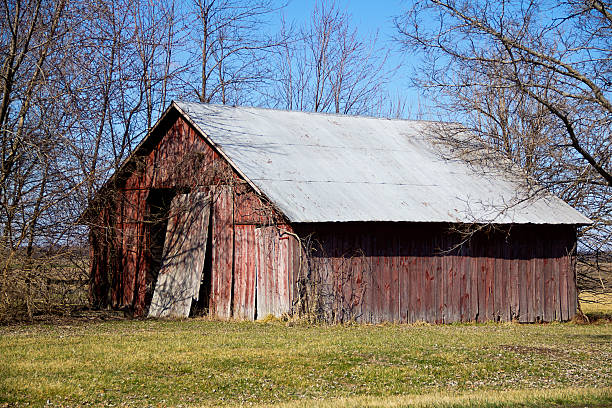 Old Red Barn with tin roof stock photo