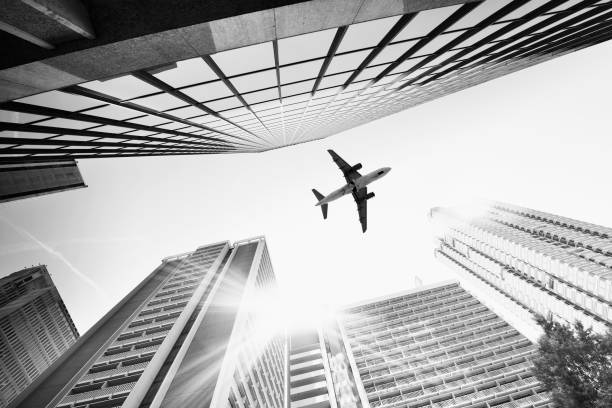 Airplane flying over skyscrapers, Atlanta, Georgia, USA.