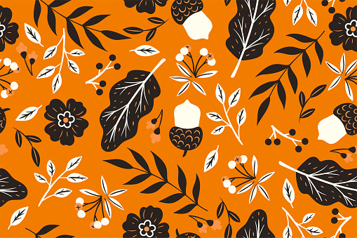 Seamless pattern with autumn leaves and acorns. Vector graphics.
