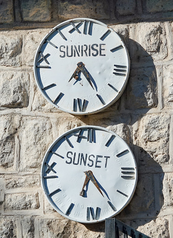 Sunrise and Sunset Clocks indicate the opening and closing times at Etosha National Park in Kunene Region, Namibia