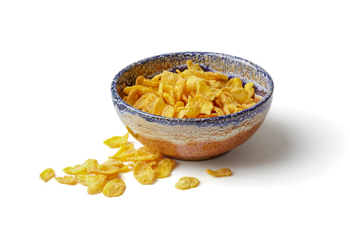 Crinkle cut potato chips in bowl isolated on a white background