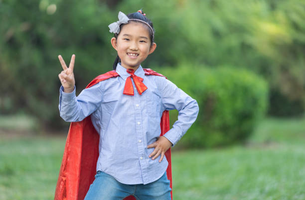 istock Supergirl Salute Making Peace Gesture 1411817493