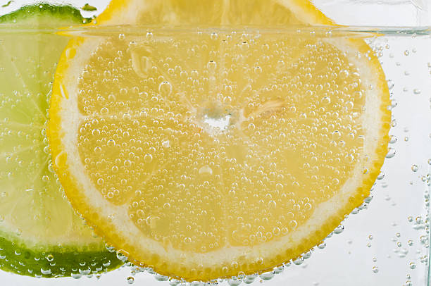 istock lemon and lime slices in soda water white background bubbles 141181761