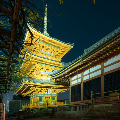 Kyoto, Japan - 12.09.2017: Lights illuminate main pagoda of Kiyomizu-dera temple on a cold December night
