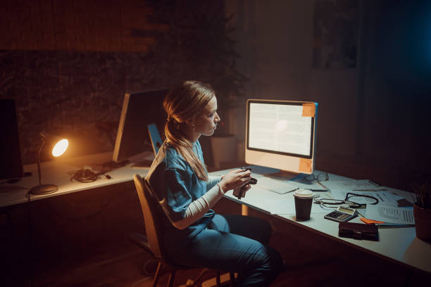 istock Female doctor working late 1411825544