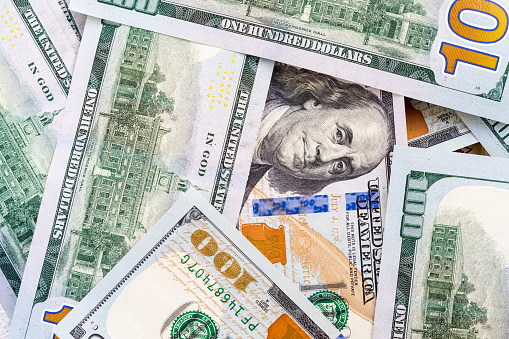 Several american dollar banknotes closeup