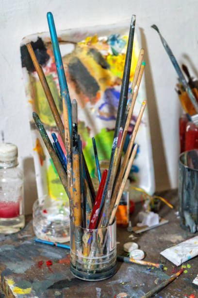 Workplace artists - brushes and paints to create masterpieces.