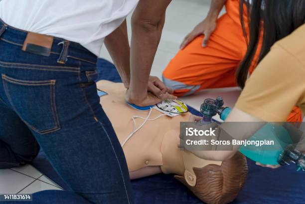 First Aid Training Heart Pump And Uses A Ventilator Stock Photo - Download Image Now