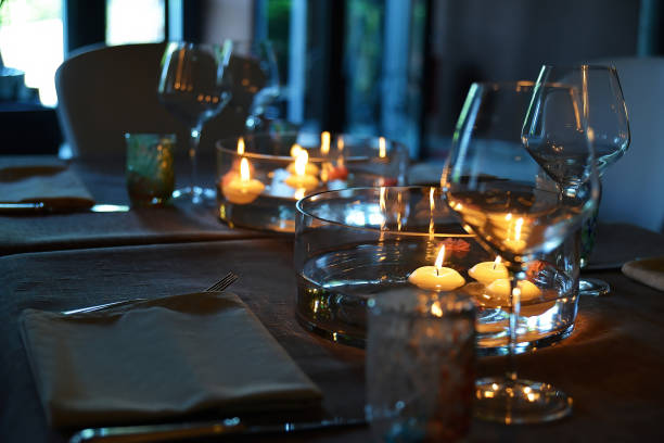 istock Table set with a centerpiece with water flowers and floating candles 1411836045