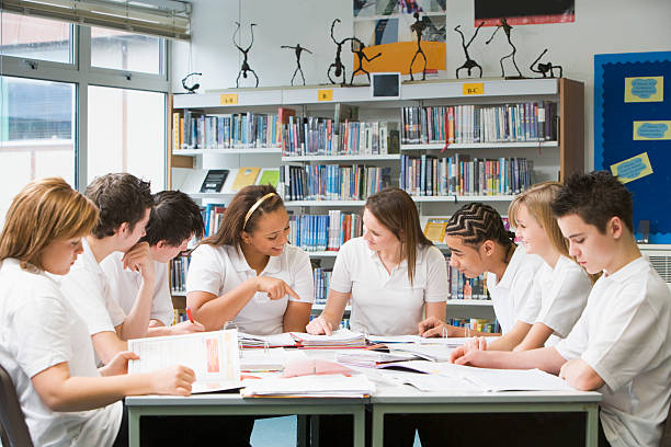istock Schoolchildren studying in school library 141183693