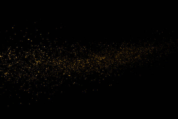 polvo de estrellas de oro - particle fotografías e imágenes de stock