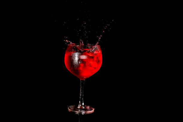istock Red wine pouring into a glass 1411837825